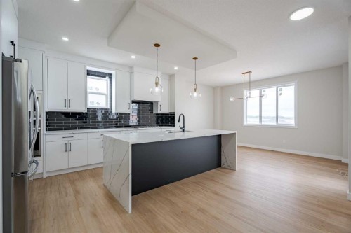 2045 Waterbury Road, Chestermere, AB - Indoor Photo Showing Kitchen With Upgraded Kitchen