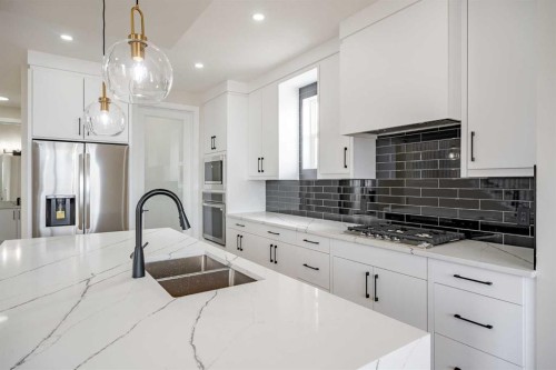 2045 Waterbury Road, Chestermere, AB - Indoor Photo Showing Kitchen With Double Sink With Upgraded Kitchen