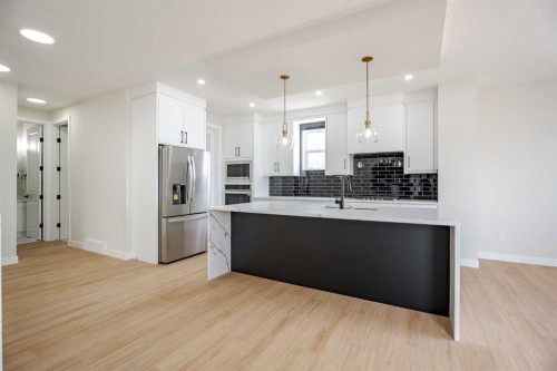 2045 Waterbury Road, Chestermere, AB - Indoor Photo Showing Kitchen With Upgraded Kitchen