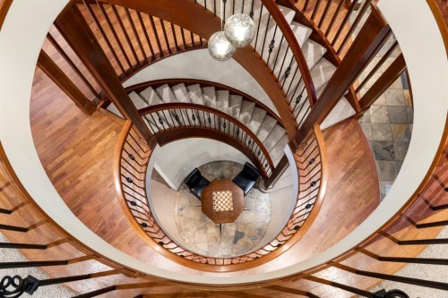 48 Coulee Park Sw, Calgary, AB - Indoor Photo Showing Other Room With Fireplace