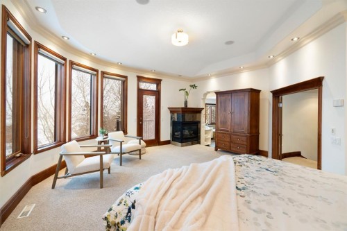 48 Coulee Park Sw, Calgary, AB - Indoor With Fireplace