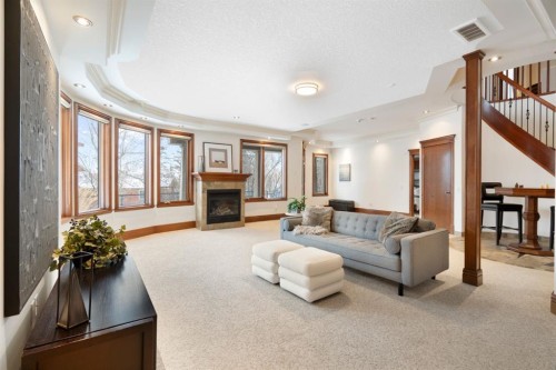 48 Coulee Park Sw, Calgary, AB - Indoor Photo Showing Living Room With Fireplace
