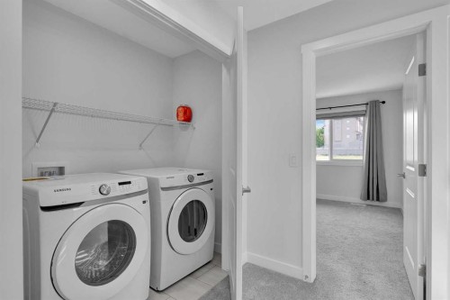 59 Belgian, Cochrane, AB - Indoor Photo Showing Laundry Room