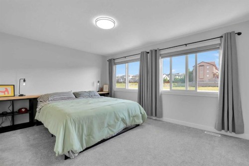 59 Belgian, Cochrane, AB - Indoor Photo Showing Bedroom