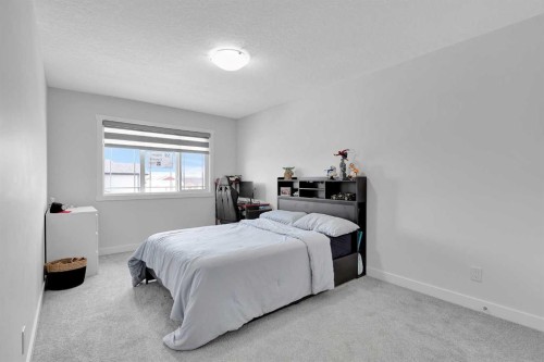 59 Belgian, Cochrane, AB - Indoor Photo Showing Bedroom