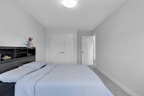 59 Belgian, Cochrane, AB - Indoor Photo Showing Bedroom