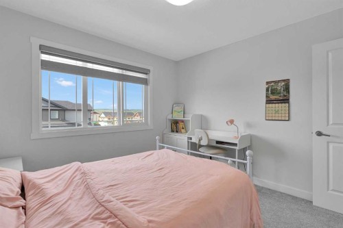 59 Belgian, Cochrane, AB - Indoor Photo Showing Bedroom