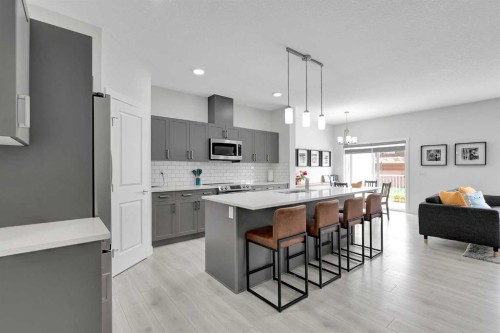 59 Belgian, Cochrane, AB - Indoor Photo Showing Kitchen With Upgraded Kitchen