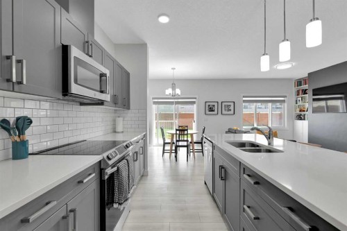 59 Belgian, Cochrane, AB - Indoor Photo Showing Kitchen With Double Sink With Upgraded Kitchen