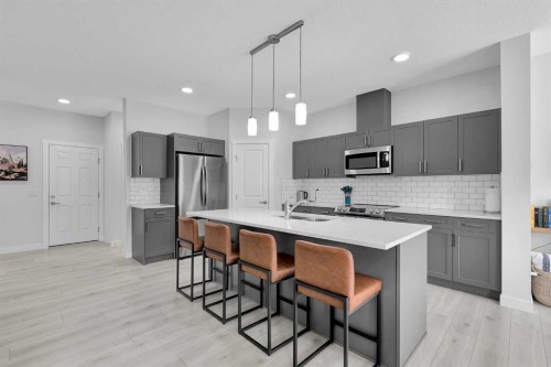 59 Belgian, Cochrane, AB - Indoor Photo Showing Kitchen With Stainless Steel Kitchen With Upgraded Kitchen