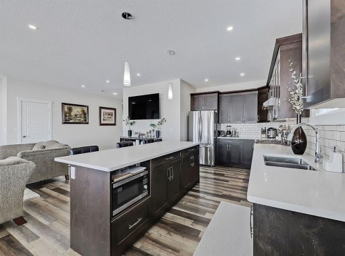 125 Westview Drive, Nanton, AB - Indoor Photo Showing Kitchen With Double Sink With Upgraded Kitchen