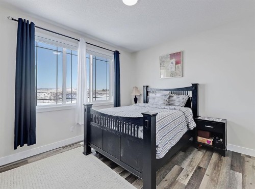 125 Westview Drive, Nanton, AB - Indoor Photo Showing Bedroom