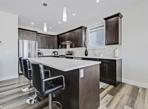 125 Westview Drive, Nanton, AB - Indoor Photo Showing Kitchen With Upgraded Kitchen