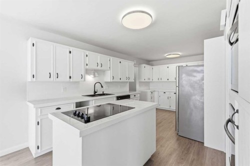 5031 Vienna Drive Nw, Calgary, AB - Indoor Photo Showing Kitchen With Double Sink