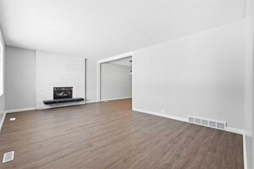 5031 Vienna Drive Nw, Calgary, AB - Indoor With Fireplace