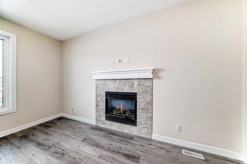 437 Redstone Grove Ne, Calgary, AB - Indoor Photo Showing Living Room With Fireplace