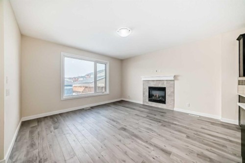 437 Redstone Grove Ne, Calgary, AB - Indoor Photo Showing Living Room With Fireplace
