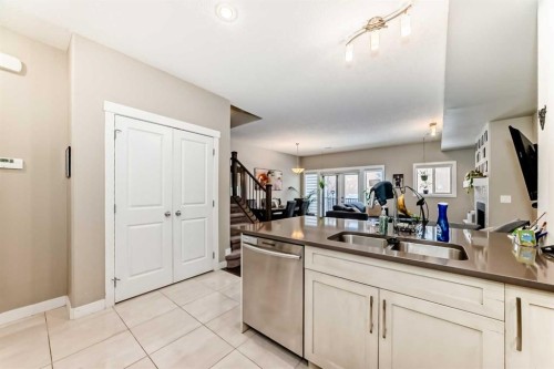 106 Cougar Ridge Landing Sw, Calgary, AB - Indoor Photo Showing Kitchen With Double Sink