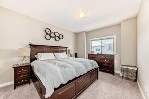 106 Cougar Ridge Landing Sw, Calgary, AB - Indoor Photo Showing Bedroom