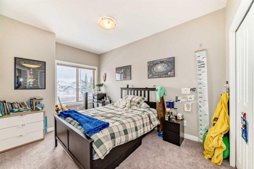 106 Cougar Ridge Landing Sw, Calgary, AB - Indoor Photo Showing Bedroom