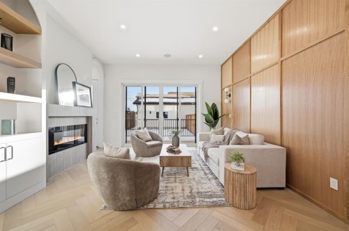 907 36 Street Nw, Calgary, AB - Indoor Photo Showing Living Room With Fireplace