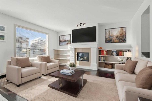 47 Everbrook Crescent Sw, Calgary, AB - Indoor Photo Showing Living Room With Fireplace