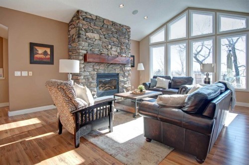 274181 Range Road 23, Rural Rocky View County, AB - Indoor Photo Showing Living Room With Fireplace