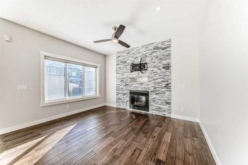 9 Saddlecrest Crescent Ne, Calgary, AB - Indoor Photo Showing Living Room With Fireplace
