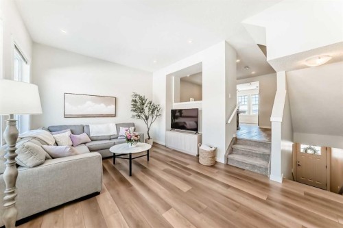 272 Cranbrook Square Se, Calgary, AB - Indoor Photo Showing Living Room With Fireplace