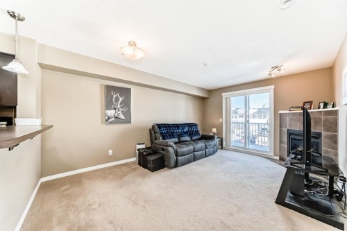 4216-31 Country Village Manor Ne, Calgary, AB - Indoor Photo Showing Living Room With Fireplace