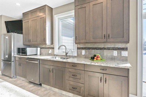108 Ravencrest Drive, Rural Foothills County, AB - Indoor Photo Showing Kitchen With Double Sink