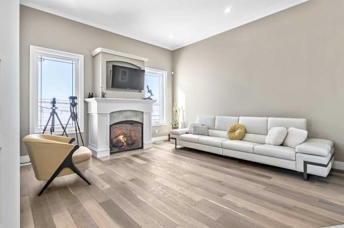 108 Ravencrest Drive, Rural Foothills County, AB - Indoor Photo Showing Living Room With Fireplace