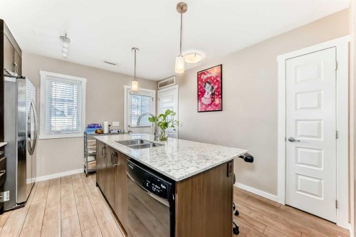 38 Auburn Bay Link Se, Calgary, AB - Indoor Photo Showing Kitchen With Double Sink
