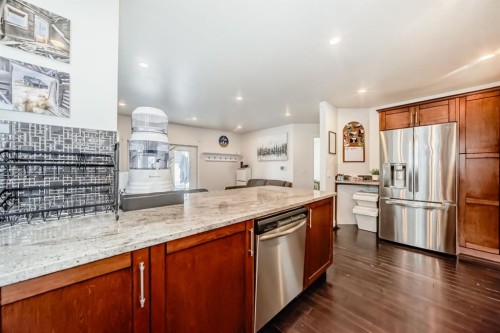 208 Woodbine Boulevard Sw, Calgary, AB - Indoor Photo Showing Kitchen With Stainless Steel Kitchen