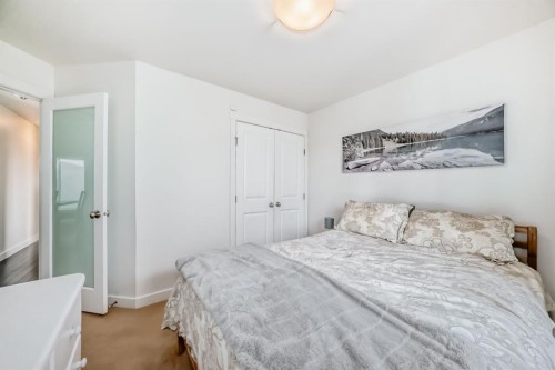 208 Woodbine Boulevard Sw, Calgary, AB - Indoor Photo Showing Bedroom