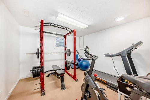 208 Woodbine Boulevard Sw, Calgary, AB - Indoor Photo Showing Gym Room