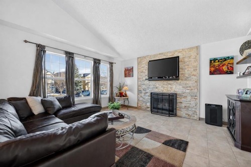 131 Covepark Place Ne, Calgary, AB - Indoor Photo Showing Living Room With Fireplace