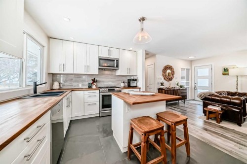 3304 46 Street Sw, Calgary, AB - Indoor Photo Showing Kitchen With Double Sink