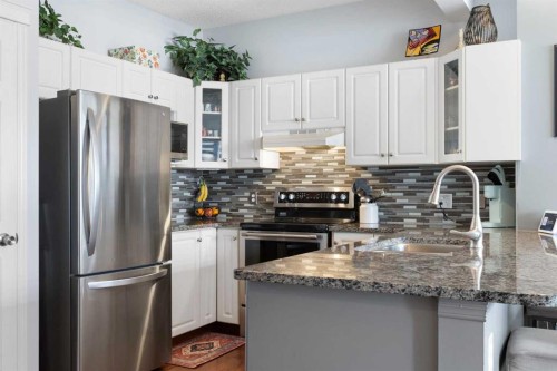 25 Promenade Way Se, Calgary, AB - Indoor Photo Showing Kitchen With Stainless Steel Kitchen With Double Sink With Upgraded Kitchen