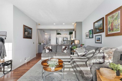 25 Promenade Way Se, Calgary, AB - Indoor Photo Showing Living Room