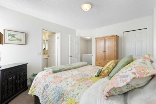 25 Promenade Way Se, Calgary, AB - Indoor Photo Showing Bedroom