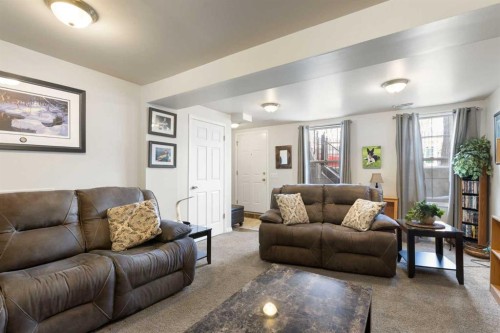 25 Promenade Way Se, Calgary, AB - Indoor Photo Showing Living Room