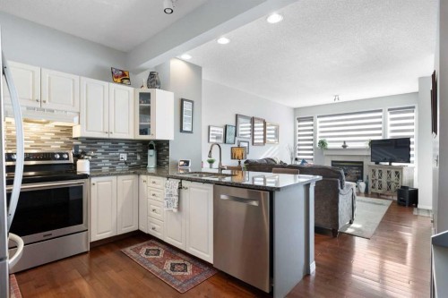 25 Promenade Way Se, Calgary, AB - Indoor Photo Showing Kitchen With Stainless Steel Kitchen