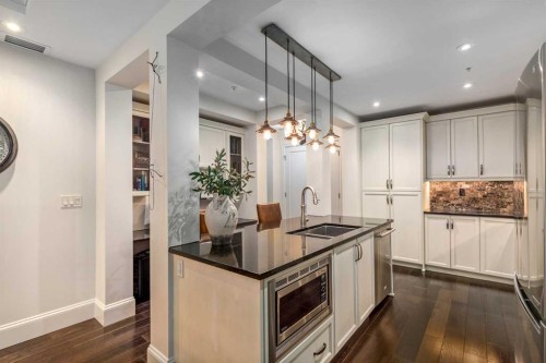 105-121 Quarry Way Se, Calgary, AB - Indoor Photo Showing Kitchen With Double Sink