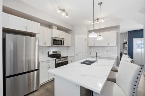 53 Sagehill Common Nw, Calgary, AB - Indoor Photo Showing Kitchen With Stainless Steel Kitchen With Double Sink With Upgraded Kitchen