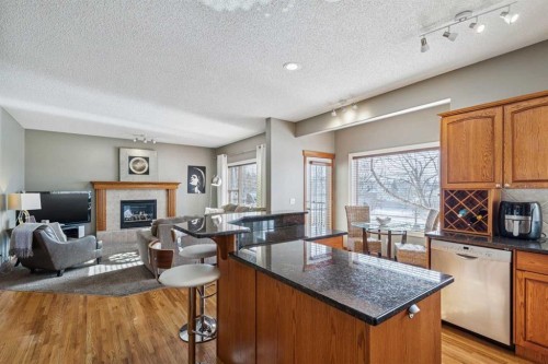 63 Evergreen Heights Sw, Calgary, AB - Indoor With Fireplace