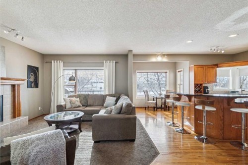 63 Evergreen Heights Sw, Calgary, AB - Indoor Photo Showing Living Room With Fireplace