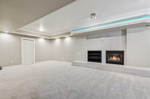 63 Evergreen Heights Sw, Calgary, AB - Indoor With Fireplace