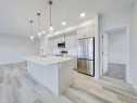 2412-220 Seton Grove Se, Calgary, AB  - Indoor Photo Showing Kitchen With Stainless Steel Kitchen With Upgraded Kitchen 