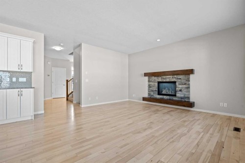 2148 Brightoncrest Green Se, Calgary, AB - Indoor Photo Showing Living Room With Fireplace